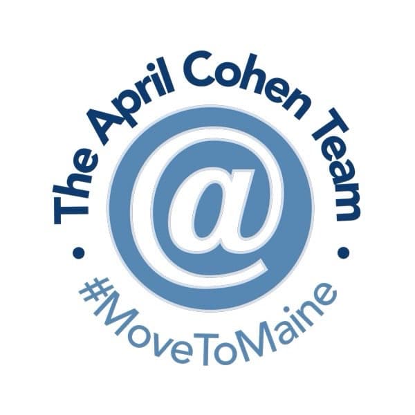 Logo featuring the text "The April Cohen Team" and the symbol "@" in a circular design, with the hashtag "#MoveToMaine" below. The color scheme includes blue and white.